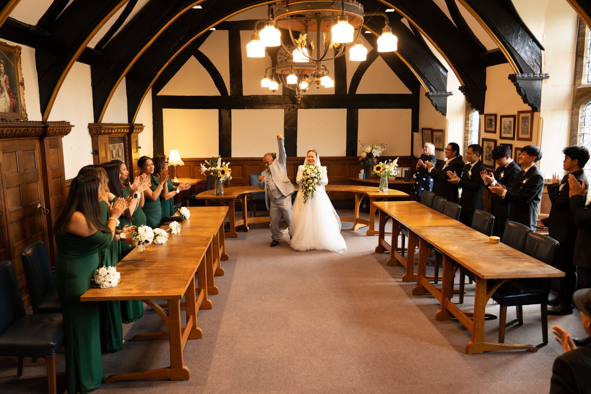 The newlyweds entering the reception to applause